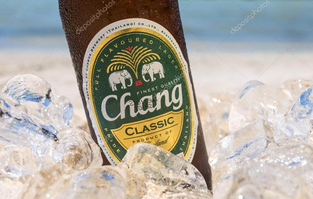 PHI PHI ISLAND,THAILAND - FEBRUARY 27,2015: Chang beer on the beach, a pale lager brewed by ThaiBev, Thailand's largest and one of Southeast Asia's largest beverage companies