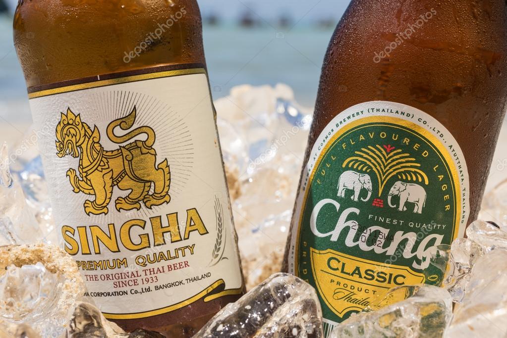 PHI PHI ISLAND,THAILAND - FEBRUARY 27,2015: Chang and Singha beer on the beach, a pale lager brewed by ThaiBev, Thailand's largest and one of Southeast Asia's largest beverage companies
