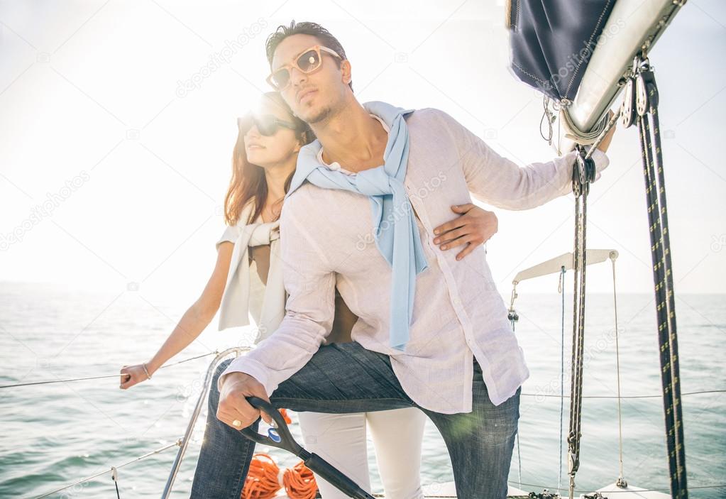 Couple sailing on boat