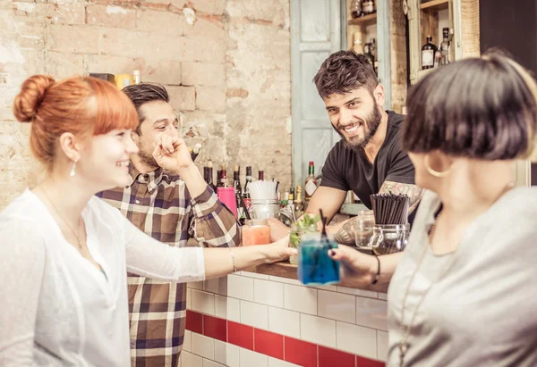 Group of friends in a bar — Stock Photo, Image