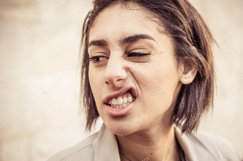 woman making disgust expression