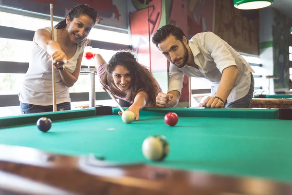 Group of young friends playing billiard 945174 Stock Photo at Vecteezy