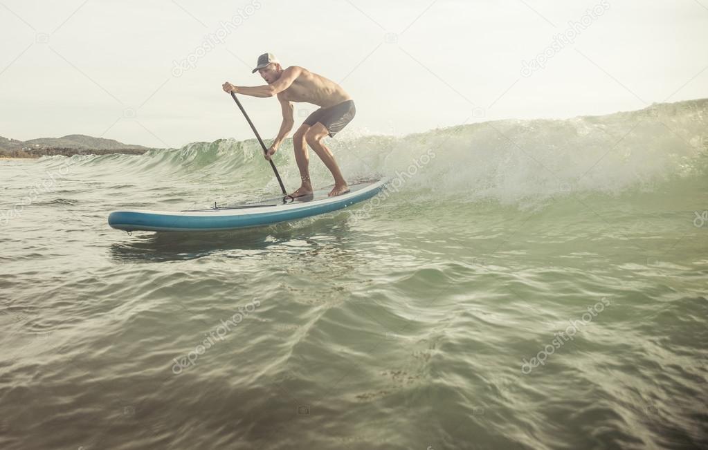 surfer with paddle board