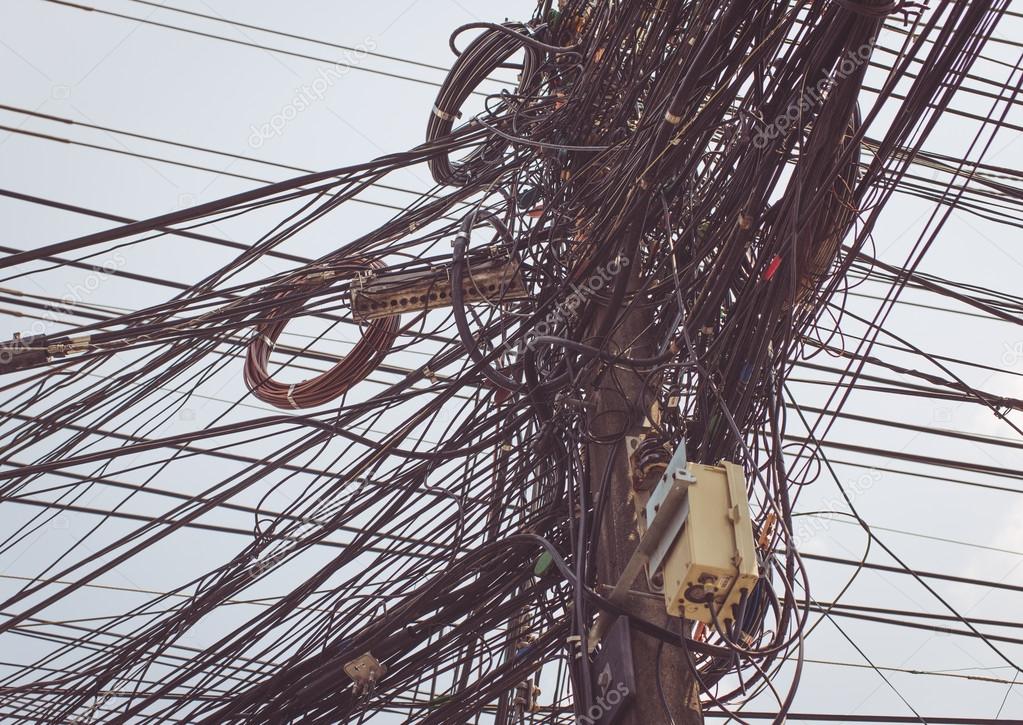 Electricity cables in thailand Stock Photo by ©oneinchpunch 75455135