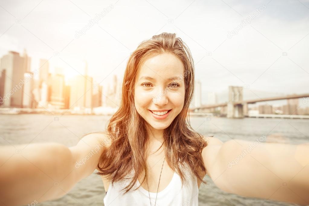 beautiful asian girl holding the camera