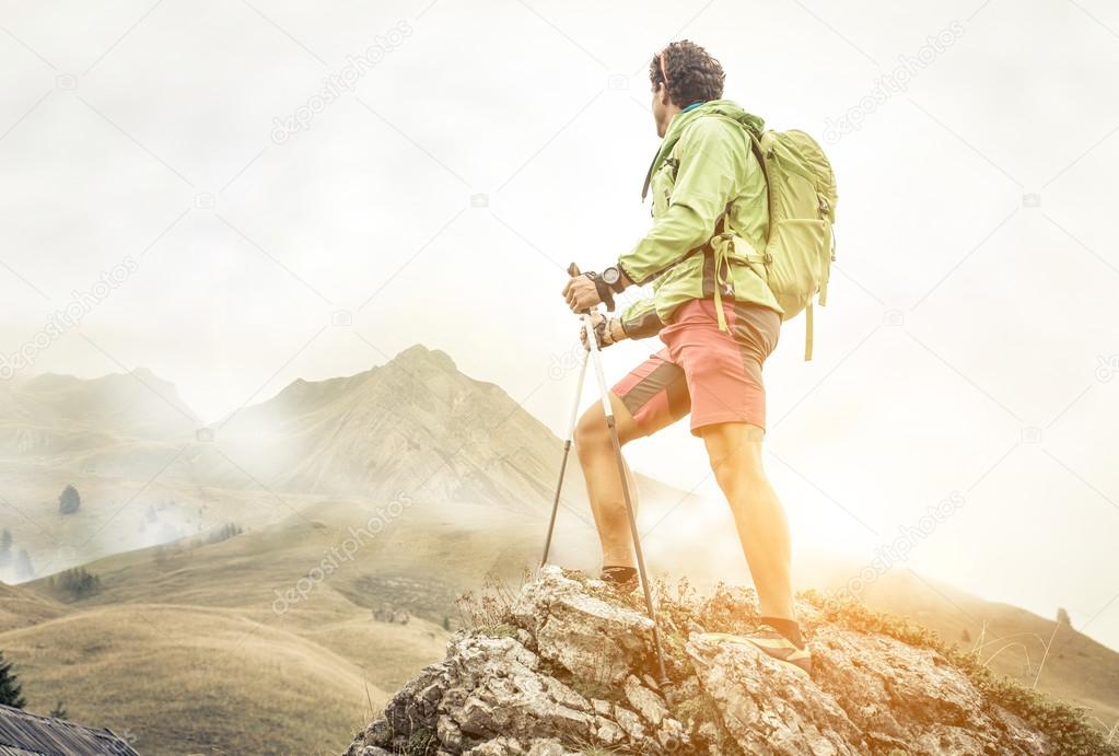 hiker climbing on the mountains