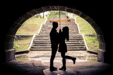 Lovers with umbrella on a rainy day