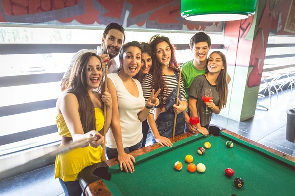 Friends at pool table