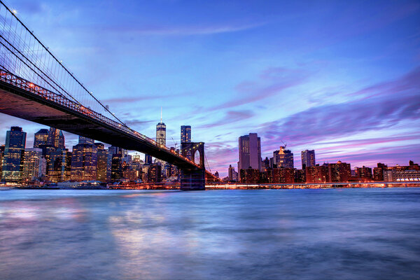 Brookyln bridge and Manhattan skyline at blue hour time. concept about traveling and landmarks