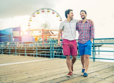 Homosexual couple walking outdoors clipart