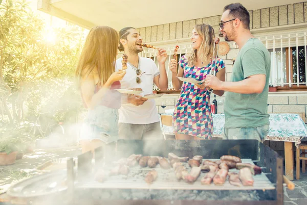 Group of friend having lunch in the backyard Stock Image