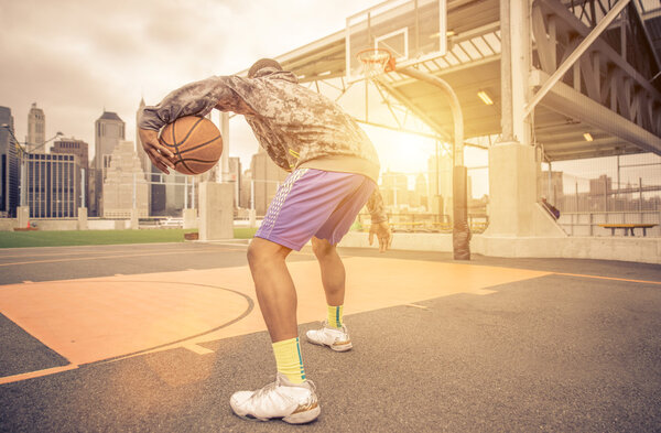 Basketball player training on the court
