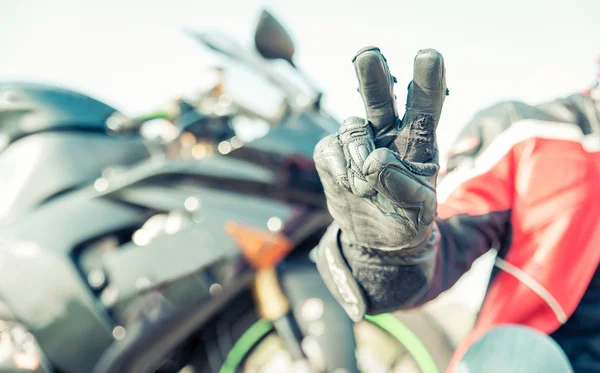 Biker greeting with the fingers — Stock Photo, Image