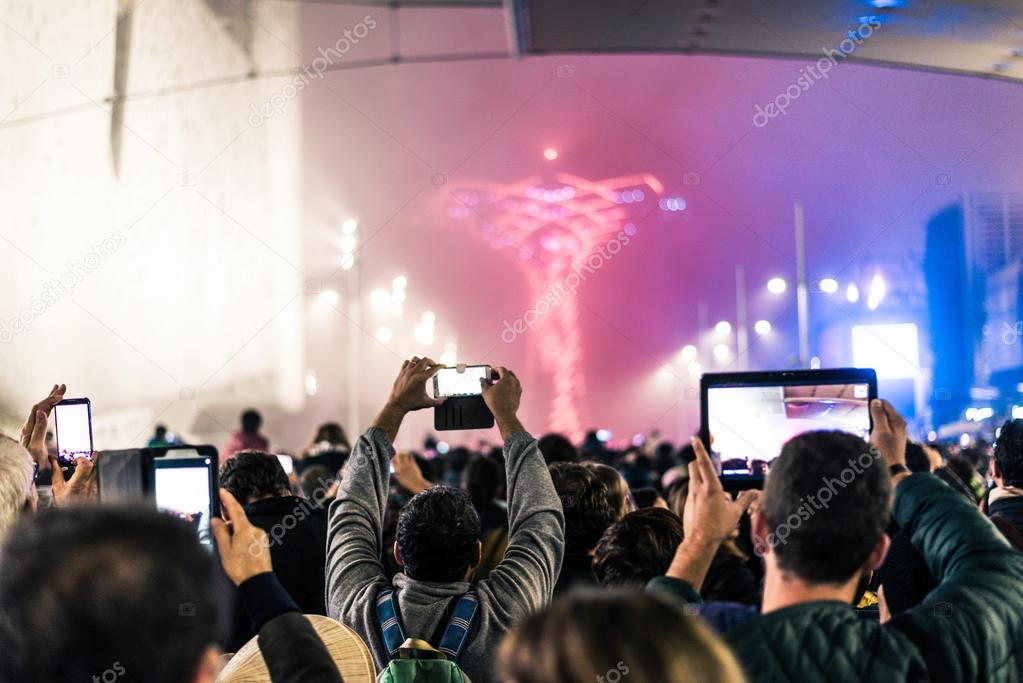 Crowd filming at an event