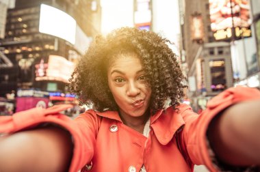Young american woman taking selfie in New york, Time square clipart