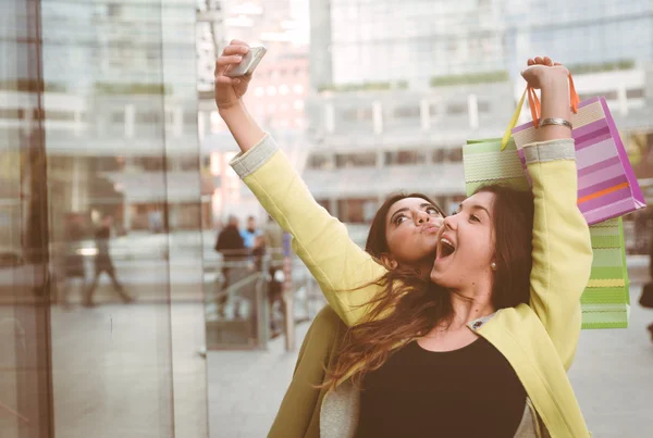 Crazy girls making shopping in the city center — Stock Photo, Image