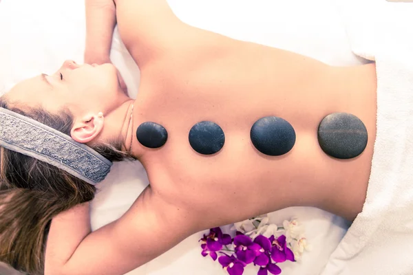 Woman having massage with hot stones — Stock Photo, Image