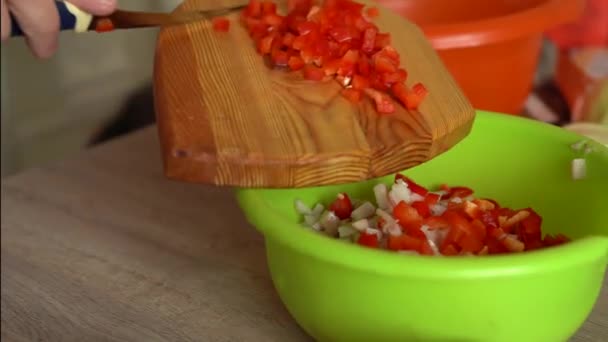 Girl makes salad. Mixes Vegetable Fresh Salad Food Healthy Meal Mediterranean Kitchen Vegetarian Diet. Slow Motion. Closeup Freshness Salad. Close up Healthy Colorful Food Onion Cucumber Peppers — Stock Video