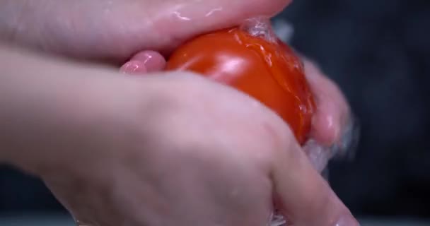 Womans hand wash the tomato in the watter. Cooking day — Stock Video