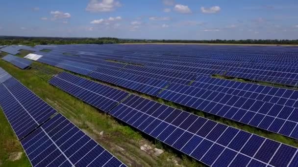 Aerial view of Solar Panels Farm with animation graphics of flowing energy lines. Drone flight fly over solar cell panels field. Renewable Alternative Green Energy Concept. Future city technology — Stockvideo