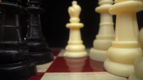 Chess figures on chess board makro shot 4k — Stockvideo