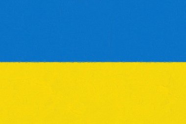 Beton bir duvara boyayla boyanmış Ukrayna bayrağı. Dünya bayrakları konsepti