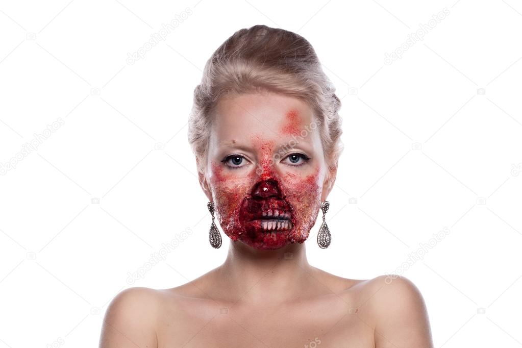 Portrait of blond bloody zombies in festive makeup, isolated on 