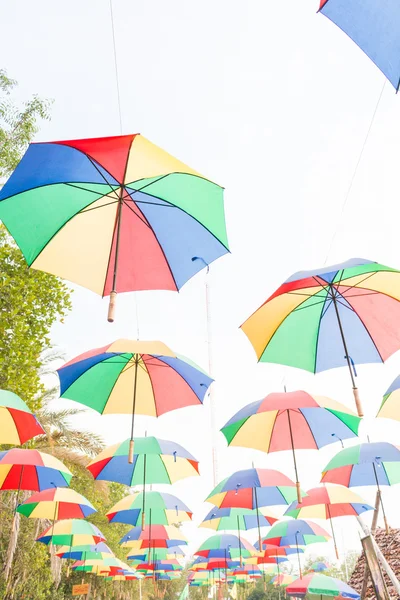 Rainbow umbrella on sky background — Stock Photo, Image