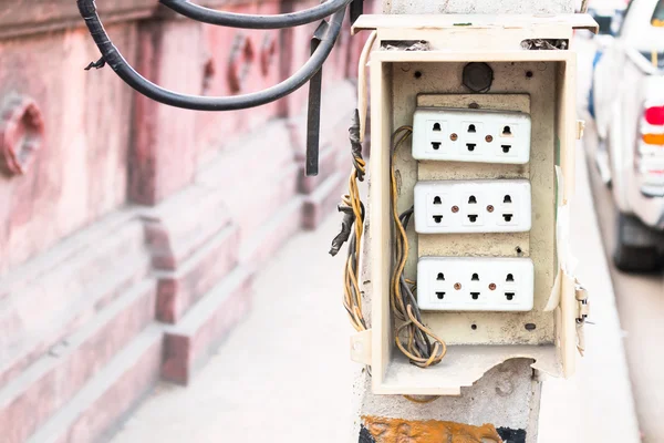Wall plug on power pole on the side of the road. — Stock Photo, Image
