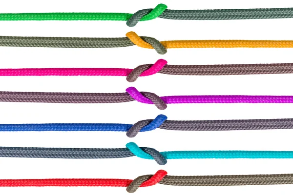 Diferentes cuerdas atadas aisladas sobre fondo blanco — Foto de Stock