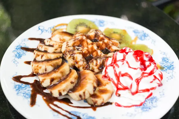 Waffles with banana and kiwi in the plate — Stock Photo, Image