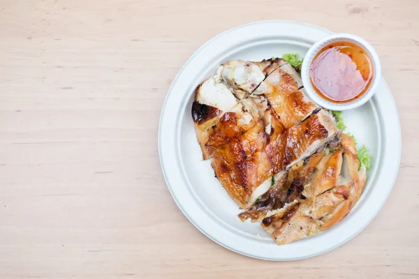 Grilled chicken on wooden background — Stock Photo, Image