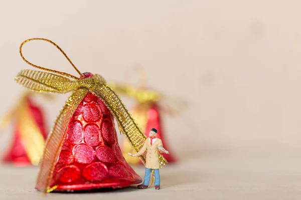 Miniature people,  Worker team painting a Christmas decoration , Christmas and Happy New Year concept.