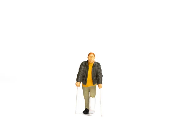 Miniature People Full Length View Man Broken Leg Using Crutch — Stock Photo, Image