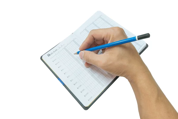 Mano sosteniendo el lápiz de madera azul en la página en blanco del cuaderno — Foto de Stock