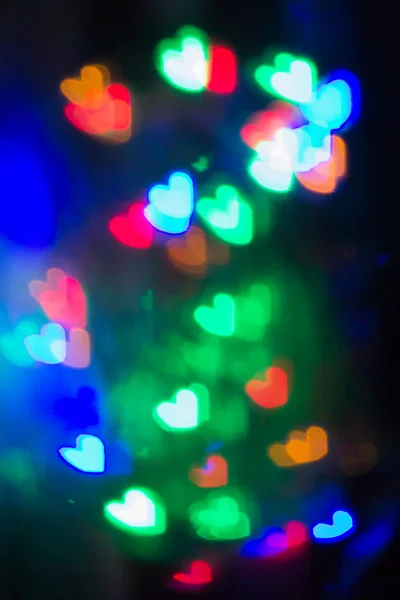 Beautiful Heart Shaped Bokeh on black background — Stock Photo, Image