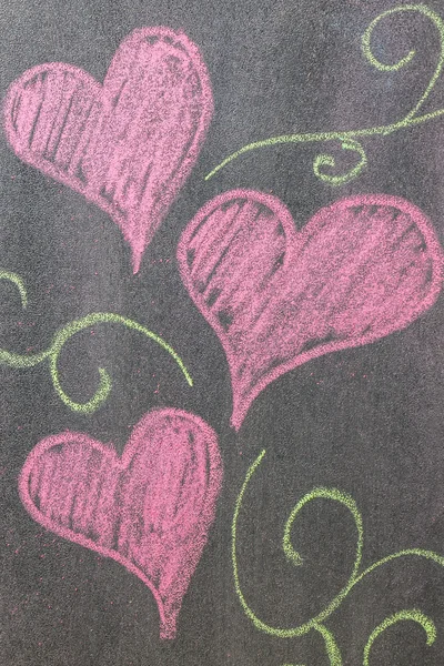 Hand drawn hearts shape on chalkboard background. — Stock Photo, Image