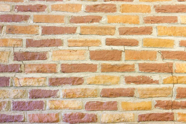 Vecchio muro di mattoni giallo e marrone Sfondo — Foto Stock