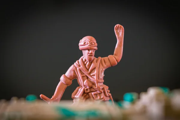 Closeup of action mini toy soldier on black background — Stock Photo, Image