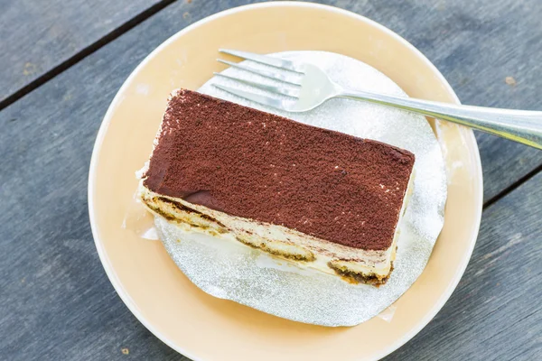 Tiramisu cake on wooden table background — Stock Photo, Image