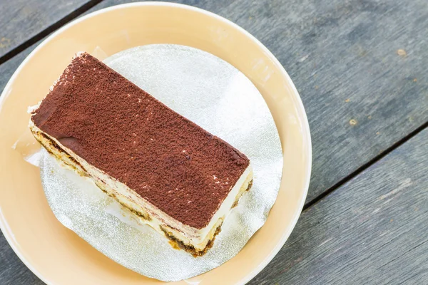 Tiramisu cake on wooden table background — Stock Photo, Image