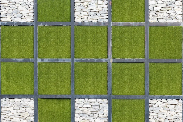 Fondo de piedra y hierba verde en bloque cuadrado — Foto de Stock