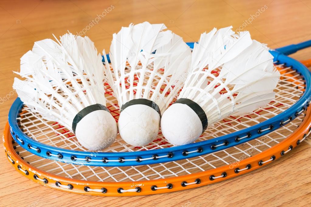 Close up White Shuttlecock on wooden background