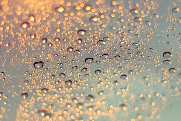 Absztrakt háttér, életlenítés vízcseppek és üveg backgro fény — Stock Fotó