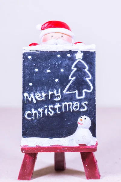 Καλά Χριστούγεννα, γραμμένο στον μαυροπίνακα, καβαλέτο ζωγραφικής. — Φωτογραφία Αρχείου