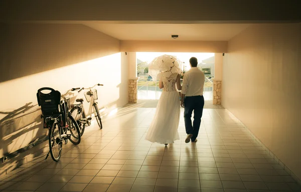 just married walking through tunnel