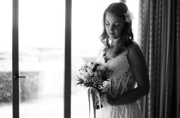 Black and white portrai of bride holding flowers — Stock Photo, Image