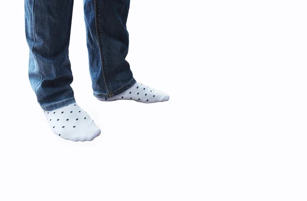 Legs in jeans and white socks — Stock Photo, Image