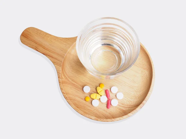 Pills medicine and glass of water — Stock Photo, Image