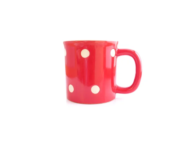 Red mug with polka dot pattern — Stock Photo, Image